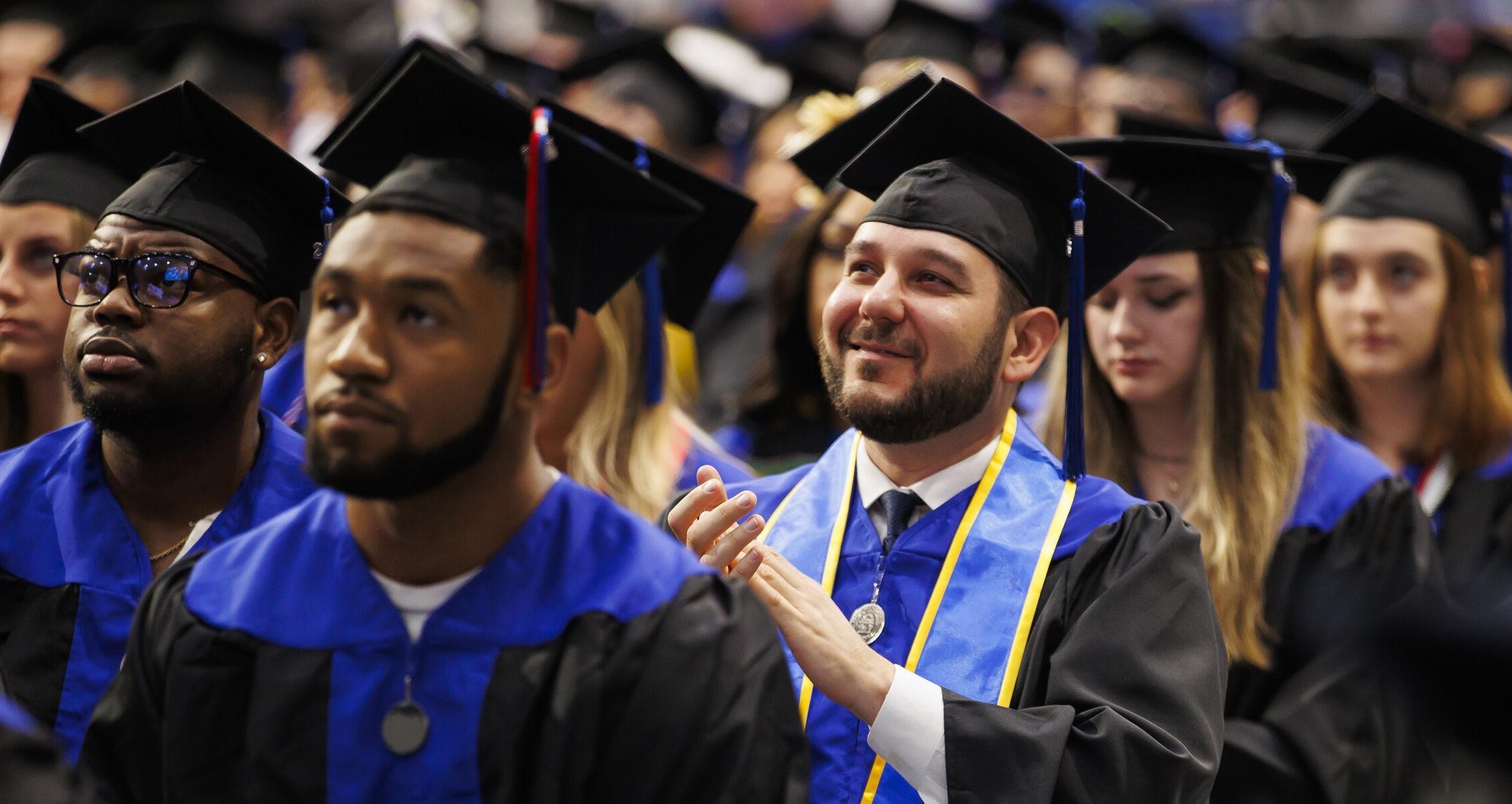 students sitting at commencement